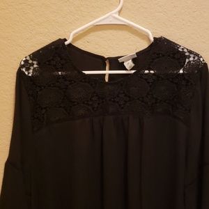 Black blouse with bell sleeves and lace detail